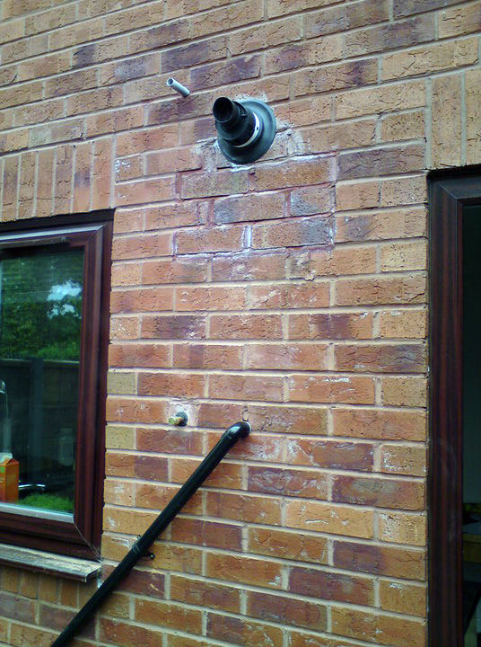 Ideal logic flue and made good brickwork half bricks removed and replaced with whole bricks wherever possible
